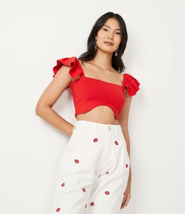 Cropped Tricot: Modelo Com Mangas E Barra Assimétrica Imagem Cropped Tricot Com Mangas E Barra Assimétrica